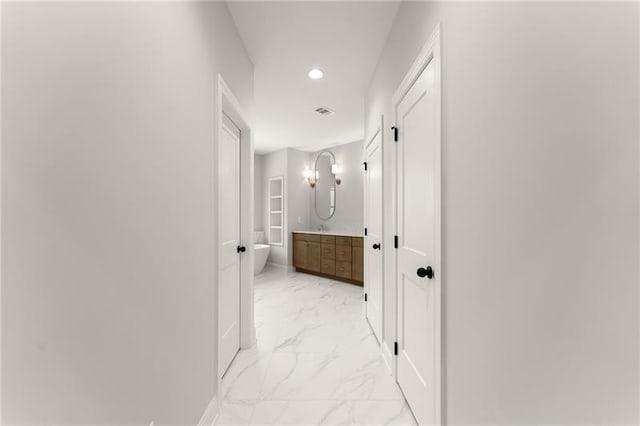 4860 Grandview Ct, Flowery Branch, GA 30542 - hallway featuring light marble finish floors and recessed lighting