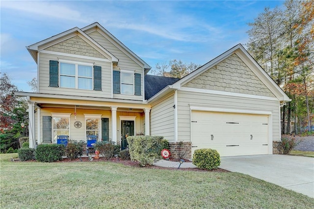 craftsman inspired home featuring a porch, a garage, and a front lawn