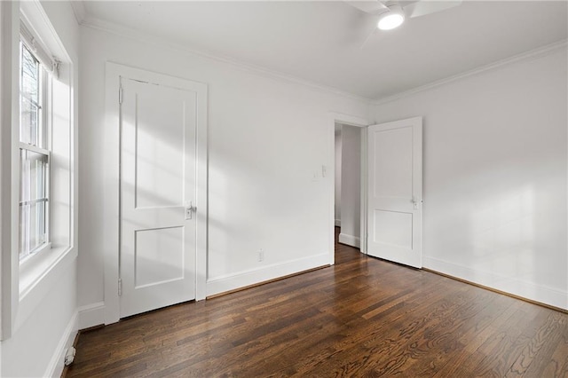 unfurnished bedroom featuring ceiling fan, ornamental molding, and dark hardwood / wood-style flooring