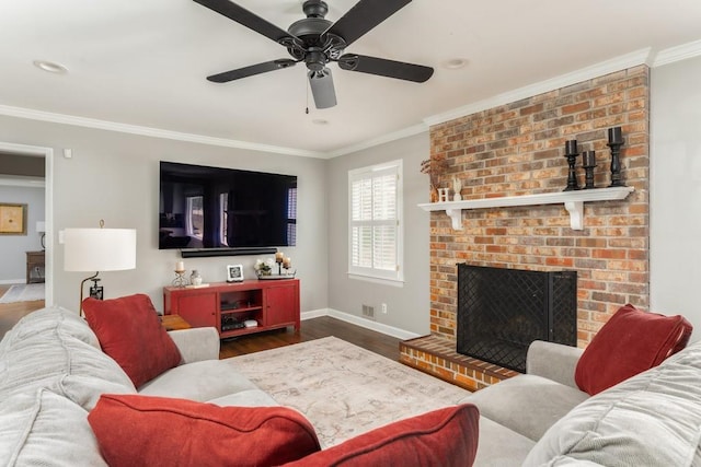 living room featuring ornamental molding, a fireplace, baseboards, and wood finished floors