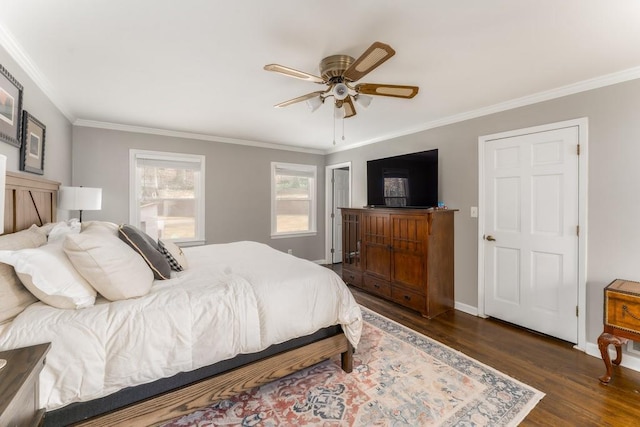 bedroom with baseboards, ceiling fan, dark wood finished floors, and crown molding