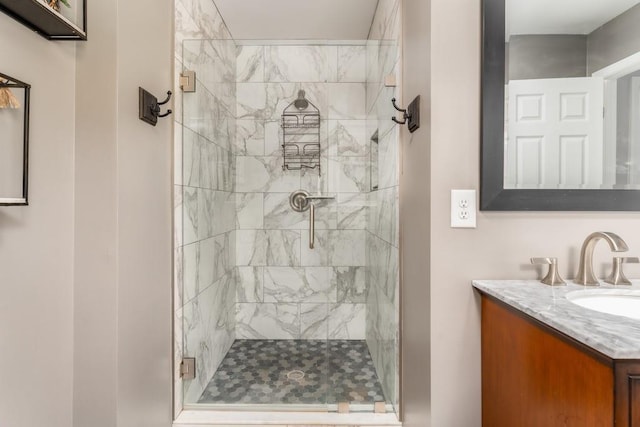 bathroom featuring a stall shower and vanity