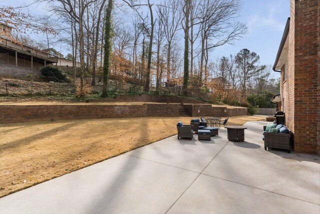 view of patio with fence and an outdoor living space