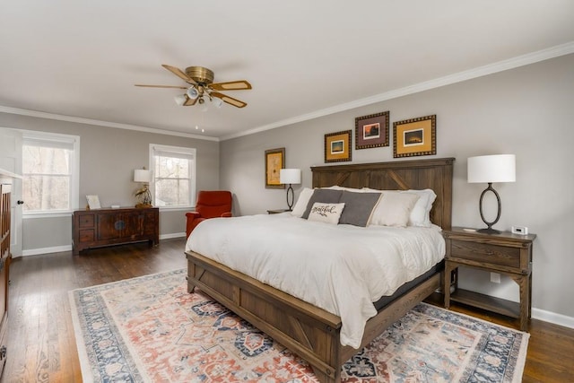 bedroom with ornamental molding, baseboards, and wood finished floors