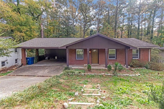 ranch-style house featuring a porch and a carport