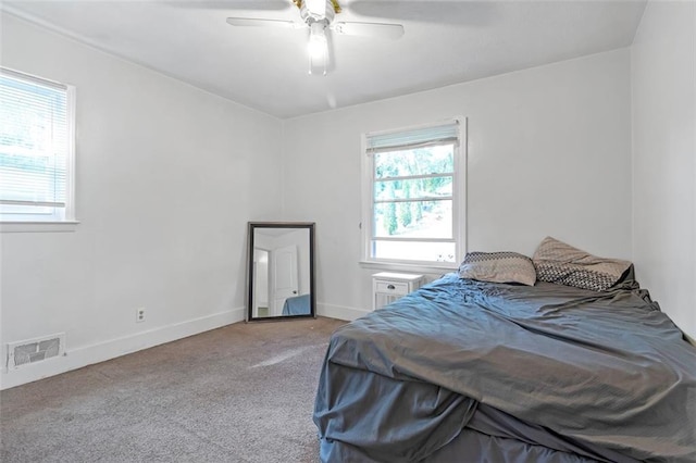 bedroom with light colored carpet and ceiling fan