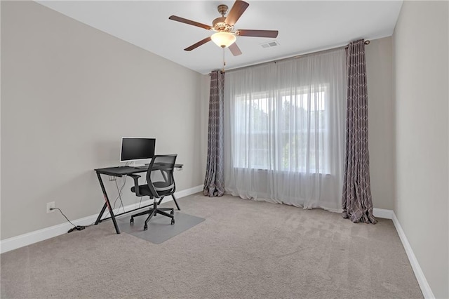 home office featuring baseboards, ceiling fan, carpet flooring, and visible vents