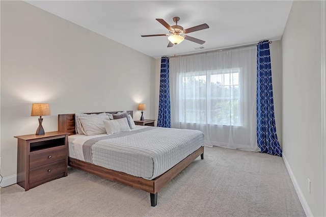 bedroom featuring carpet floors, baseboards, and a ceiling fan