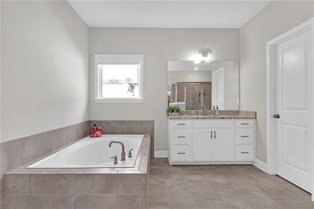 bathroom with vanity, a shower stall, tile patterned floors, and a bath