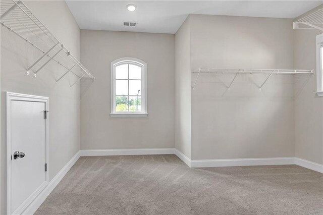 walk in closet with carpet floors and visible vents