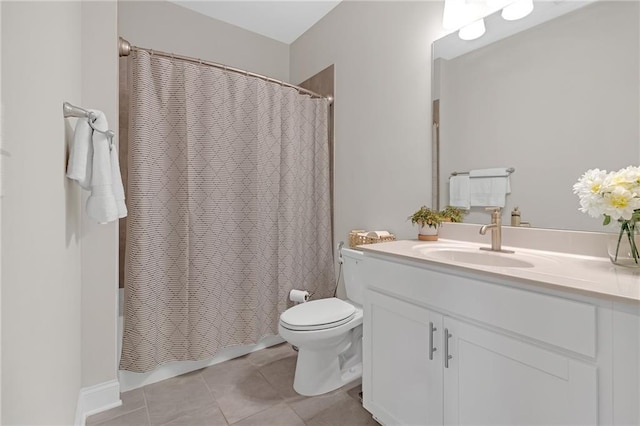 bathroom with vanity, tile patterned flooring, shower / bath combo with shower curtain, and toilet