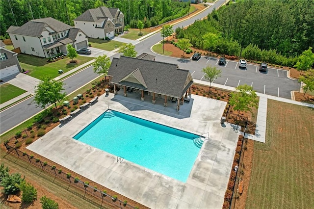 community pool with a patio area