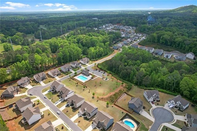 aerial view with a residential view and a wooded view