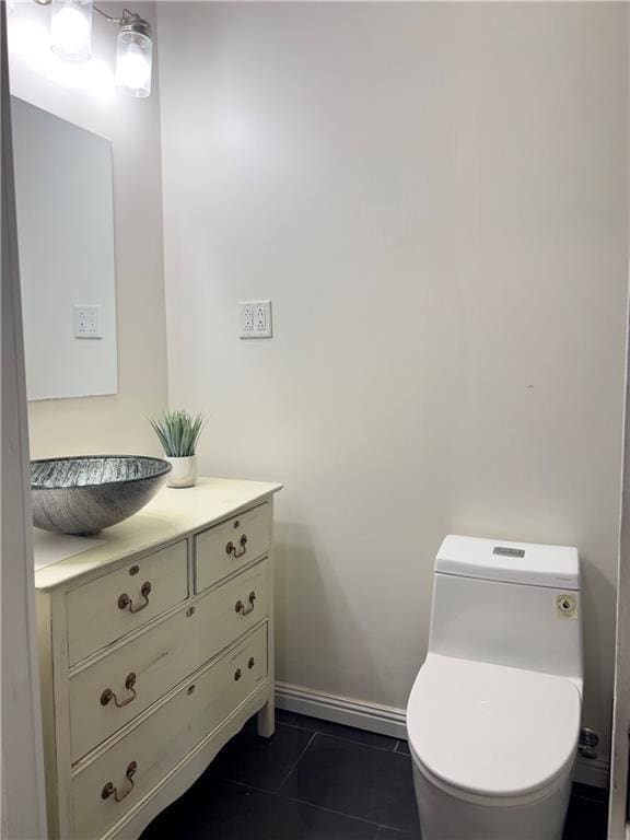 632 Monroe St, Macon, GA 31201 - bathroom featuring vanity, tile patterned floors, toilet, and baseboards