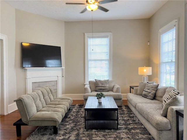 632 Monroe St, Macon, GA 31201 - living area featuring a ceiling fan, wood finished floors, and baseboards