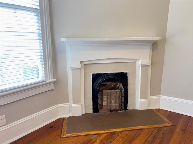 632 Monroe St, Macon, GA 31201 - detailed view of wood finished floors and a fireplace with flush hearth