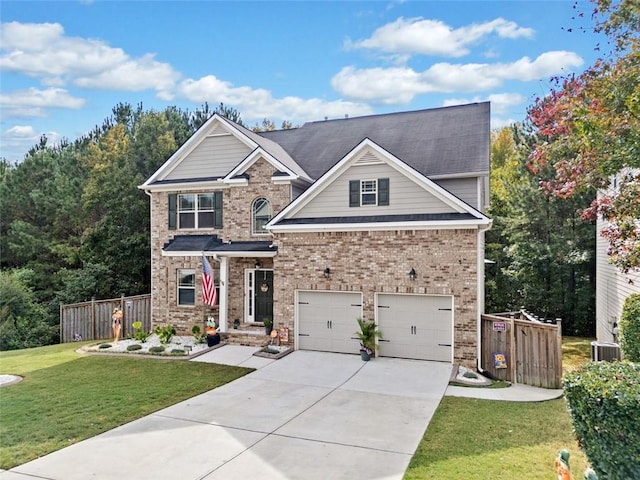 craftsman-style home featuring a garage, brick siding, fence, concrete driveway, and a front lawn