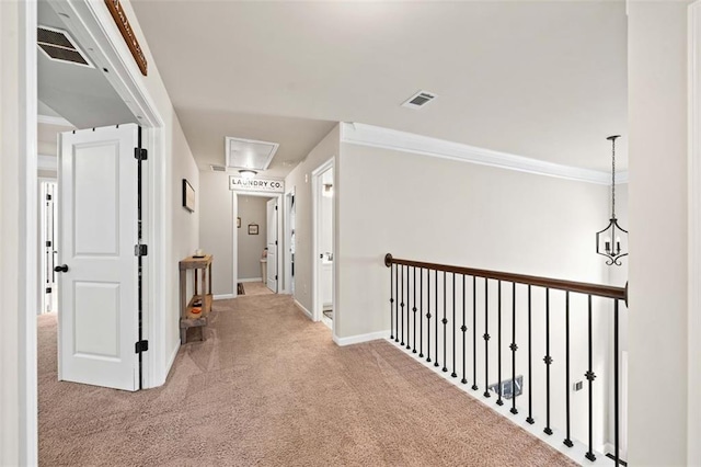 corridor featuring carpet flooring and a notable chandelier