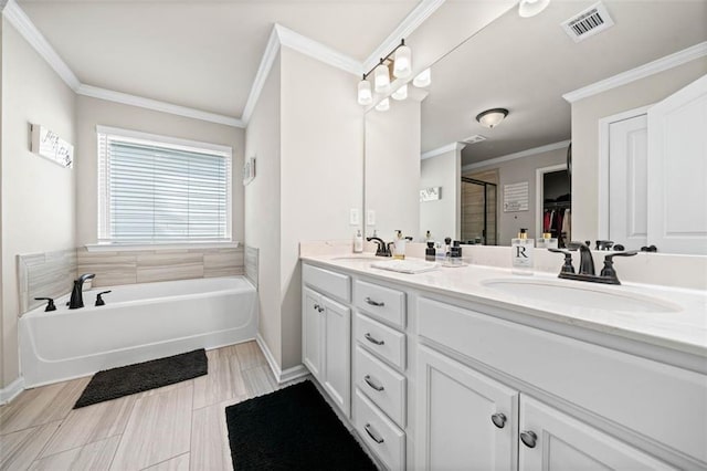 bathroom with vanity, ornamental molding, and plus walk in shower