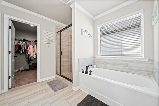 bathroom with ornamental molding and plus walk in shower