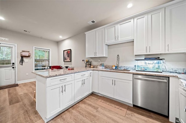 kitchen featuring dishwasher, white cabinets, sink, light hardwood / wood-style flooring, and light stone countertops