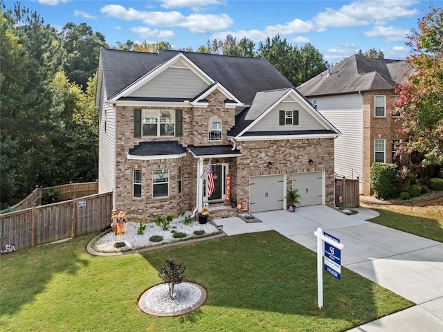 craftsman inspired home featuring a garage and a front yard