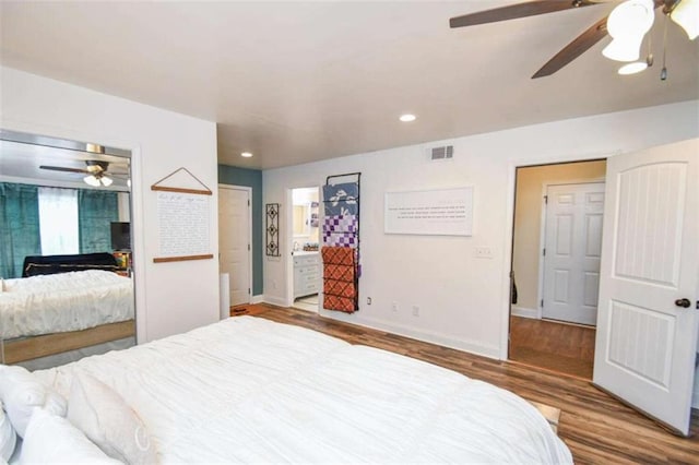 bedroom with hardwood / wood-style flooring and ceiling fan