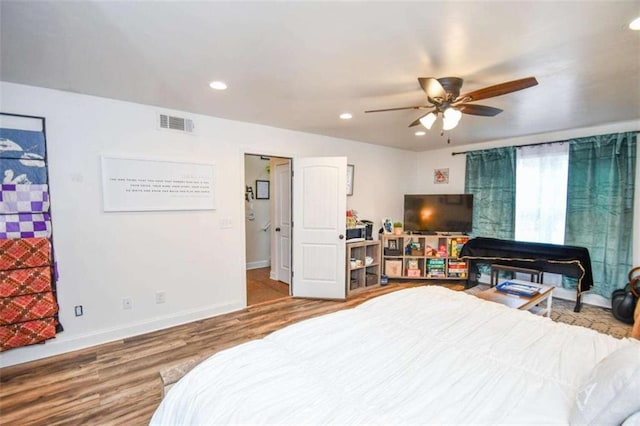 bedroom with wood-type flooring and ceiling fan