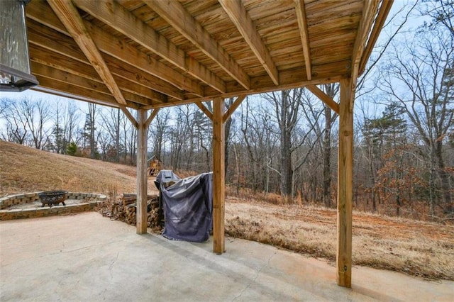 view of patio featuring an outdoor fire pit