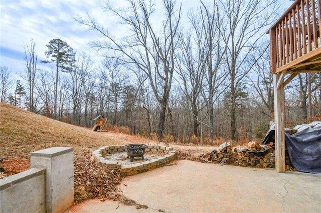 view of patio / terrace with a fire pit