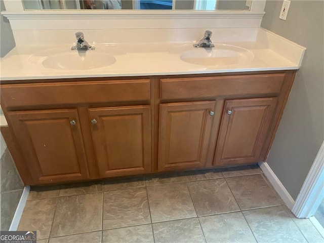 bathroom featuring double vanity and a sink