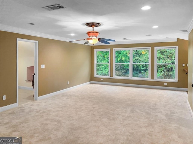 carpeted spare room featuring visible vents, ornamental molding, a ceiling fan, recessed lighting, and baseboards