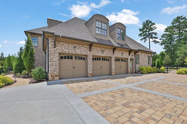 view of side of property with a garage