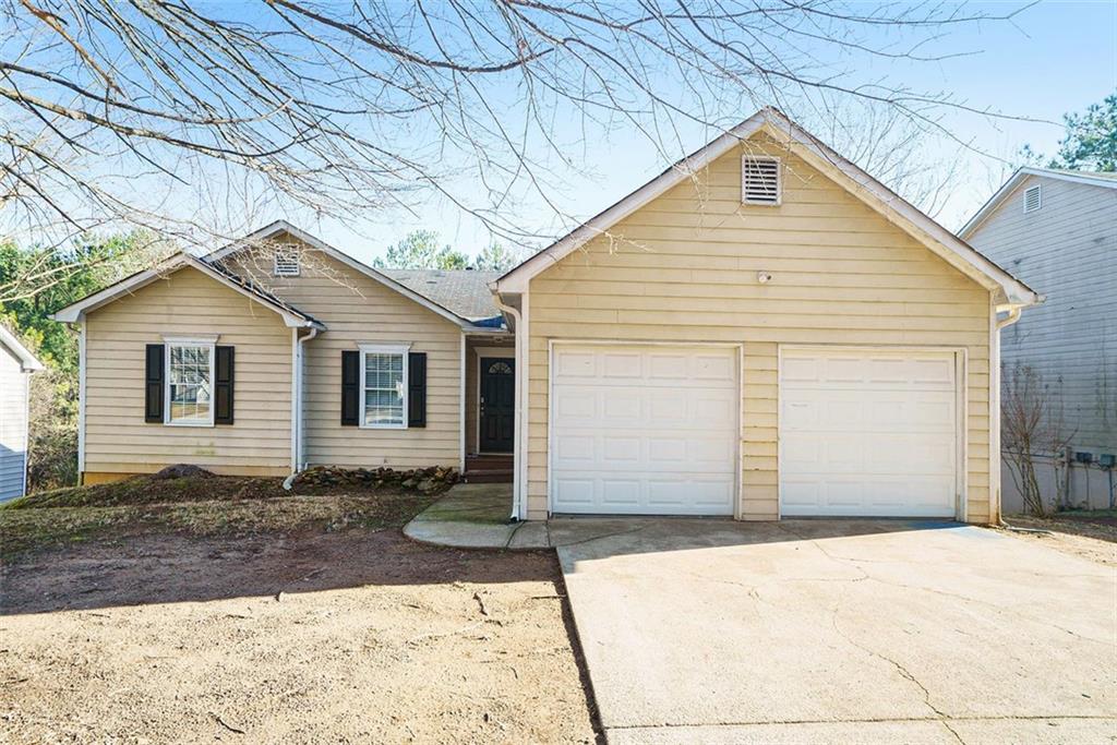 view of front of home with a garage