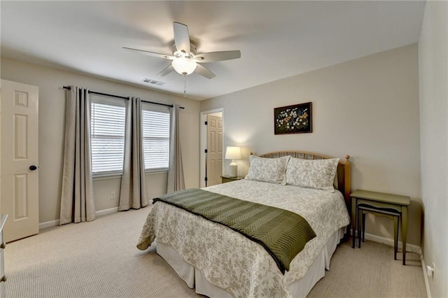 carpeted bedroom with baseboards and ceiling fan
