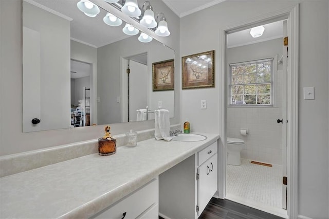 bathroom with hardwood / wood-style floors, vanity, crown molding, and toilet