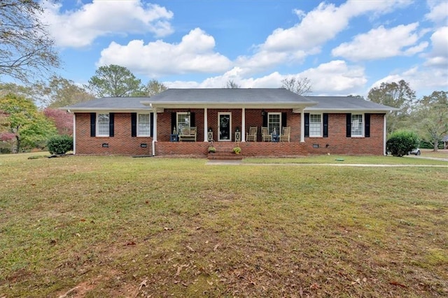 ranch-style home featuring a front lawn