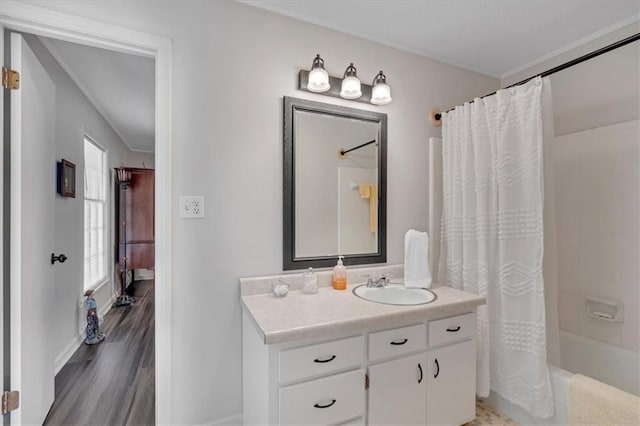 bathroom featuring vanity, shower / bath combo, and wood-type flooring