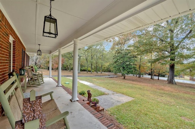 view of yard featuring covered porch