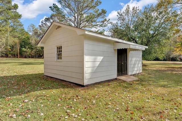 view of outdoor structure with a lawn