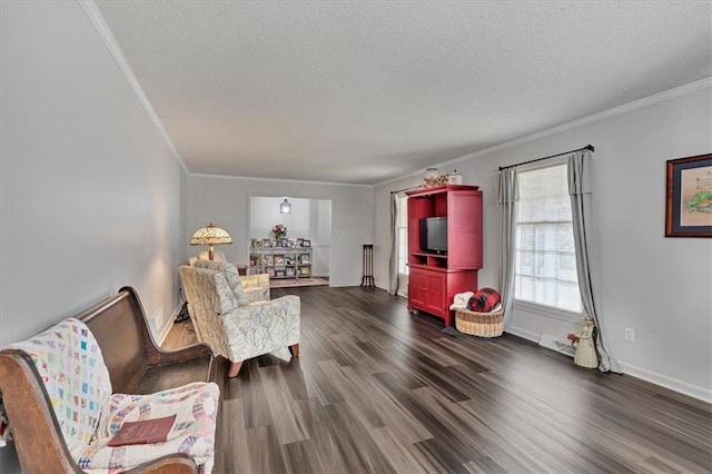 sitting room featuring crown molding, dark hardwood / wood-style floors, and a textured ceiling