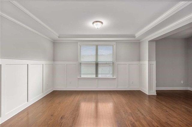 1374 Highland Wood Ct, Auburn, GA 30011 - unfurnished room with a decorative wall, hardwood / wood-style floors, crown molding, a wainscoted wall, and a raised ceiling