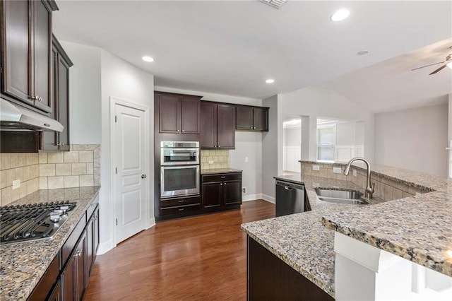 1374 Highland Wood Ct, Auburn, GA 30011 - kitchen with a sink, stainless steel appliances, under cabinet range hood, dark wood-style floors, and light stone counters