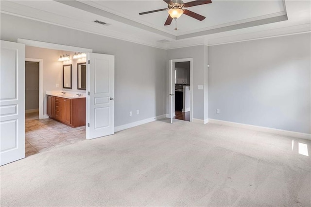 1374 Highland Wood Ct, Auburn, GA 30011 - unfurnished bedroom featuring a raised ceiling, light carpet, crown molding, baseboards, and ensuite bath