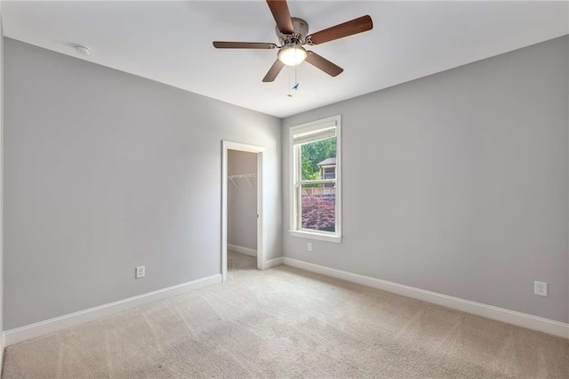 1374 Highland Wood Ct, Auburn, GA 30011 - empty room featuring light colored carpet, baseboards, and a ceiling fan