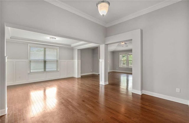 1374 Highland Wood Ct, Auburn, GA 30011 - spare room featuring wood finished floors, crown molding, ceiling fan, a wainscoted wall, and baseboards