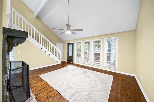 living room with dark wood-type flooring, ceiling fan, and lofted ceiling with beams