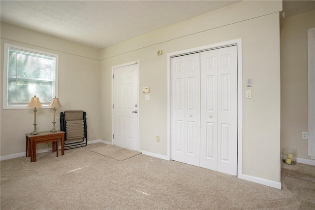 foyer featuring carpet flooring