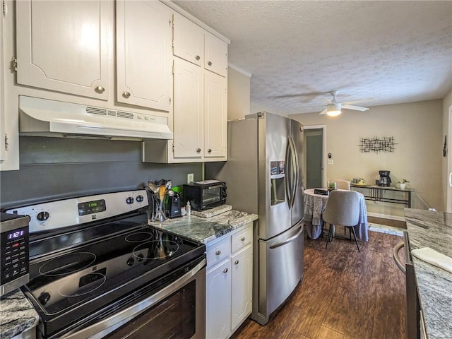 kitchen featuring dark wood-type flooring, white cabinetry, and appliances with stainless steel finishes