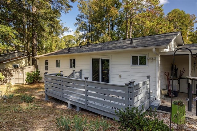 back of property with a wooden deck